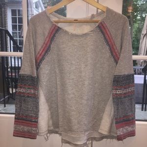 Free People sweatshirt made to look “worn”